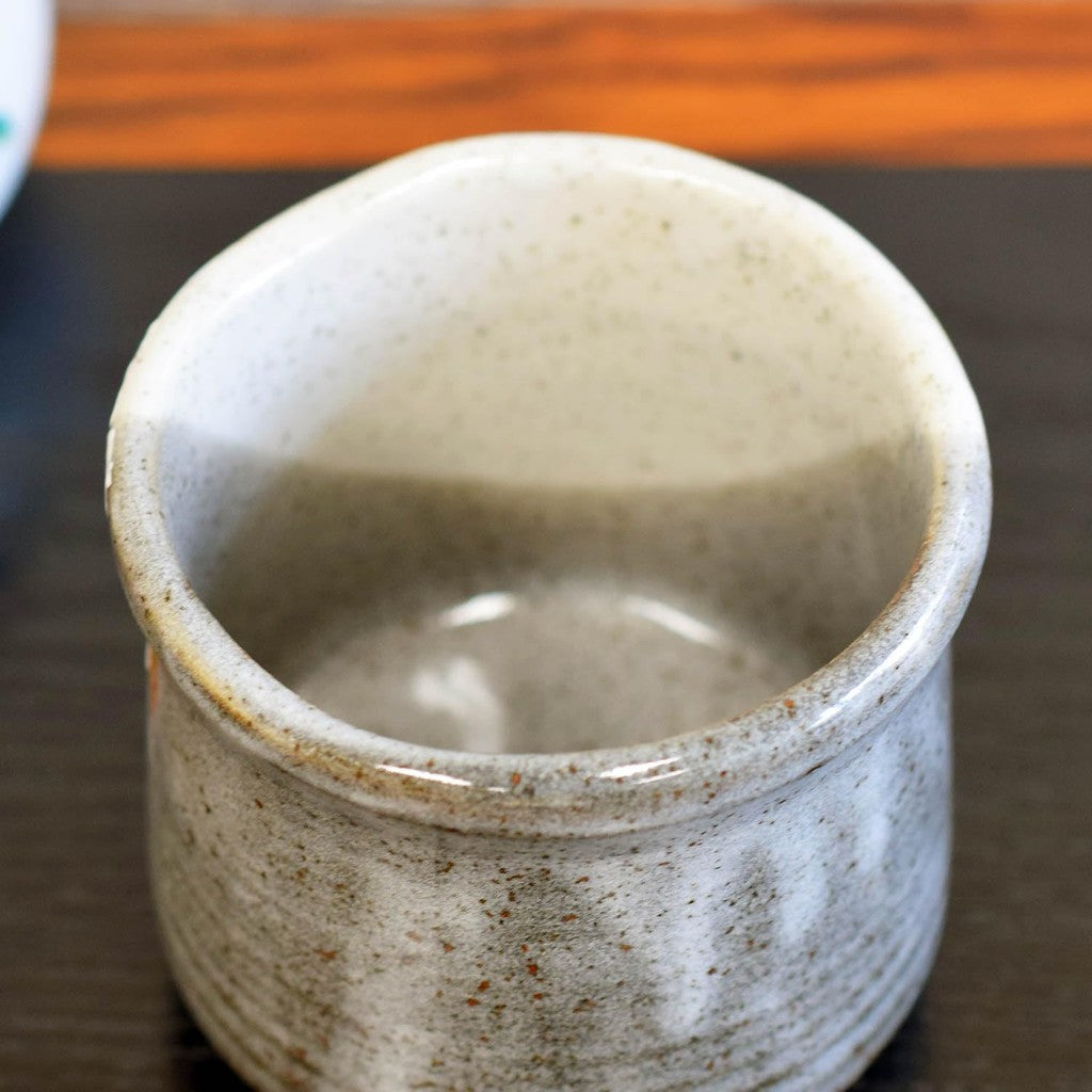 Kutani tea cup with Yoshidaya cherry blossoms and birds—premium Japanese ceramic ware.