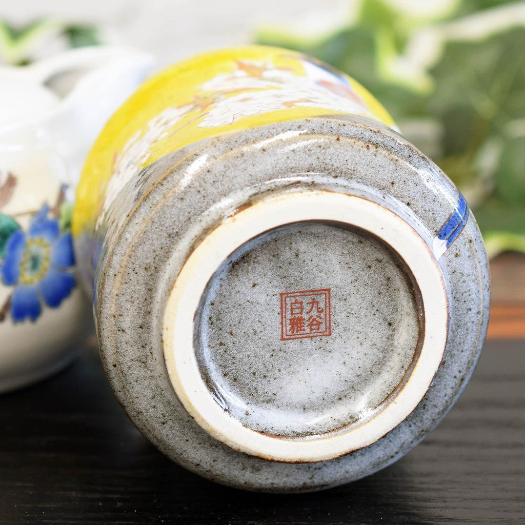 Kutani tea cup with Yoshidaya cherry blossoms and birds—premium Japanese ceramic ware.