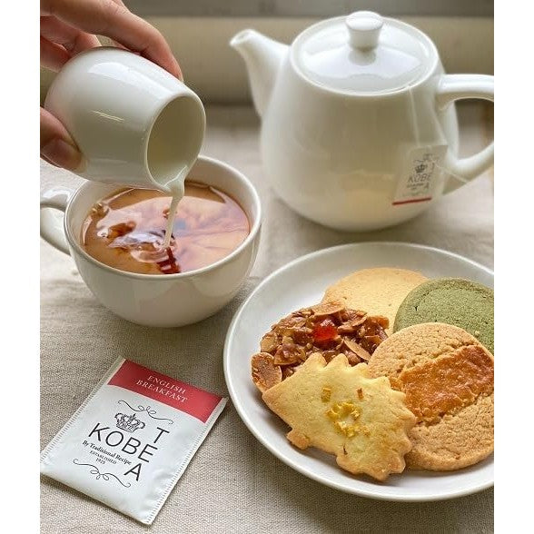 Kobe Tea Tasting Box - 28 bags of 7 varieties of loose leaf tea, meticulously selected by a tea sommelier. Includes Earl Grey, Darjeeling, English Breakfast, Royal Blend, and flavored teas in individual packaging. A luxurious tea gift with stylish tea bag