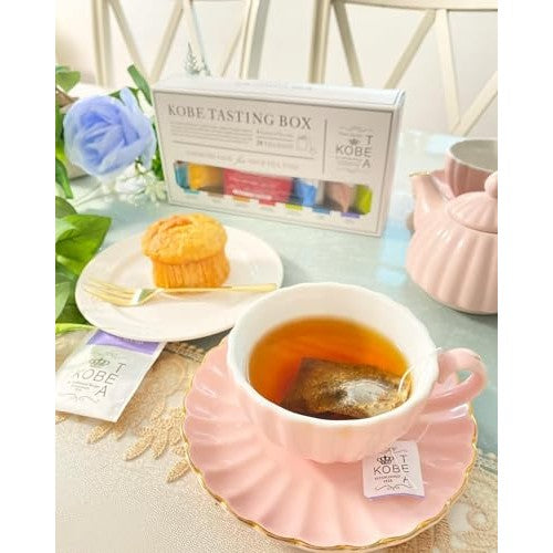 Kobe Tea Tasting Box - 28 bags of 7 varieties of loose leaf tea, meticulously selected by a tea sommelier. Includes Earl Grey, Darjeeling, English Breakfast, Royal Blend, and flavored teas in individual packaging. A luxurious tea gift with stylish tea bag
