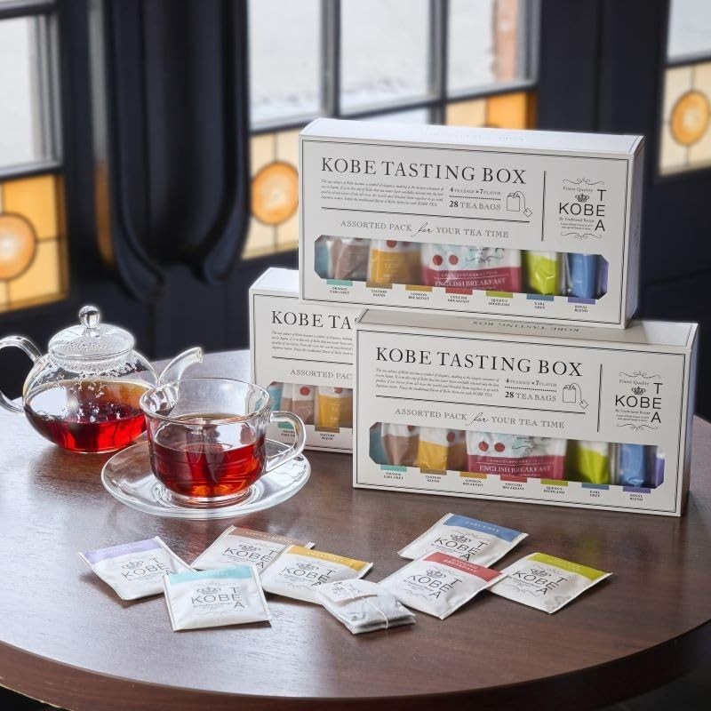 Kobe Tea Tasting Box - 28 bags of 7 varieties of loose leaf tea, meticulously selected by a tea sommelier. Includes Earl Grey, Darjeeling, English Breakfast, Royal Blend, and flavored teas in individual packaging. A luxurious tea gift with stylish tea bag